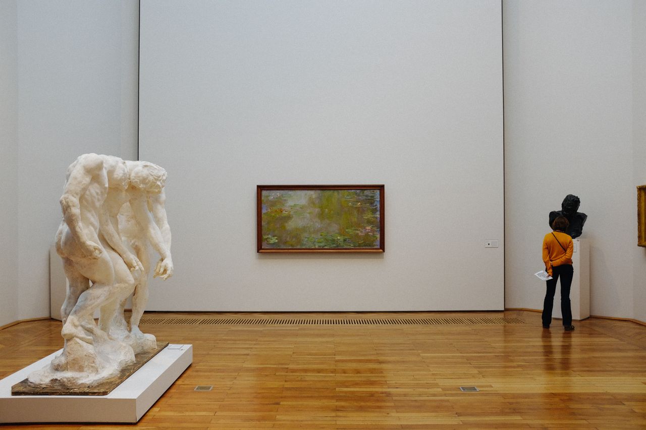 Museum editors reviewing AI-assisted cultural content together