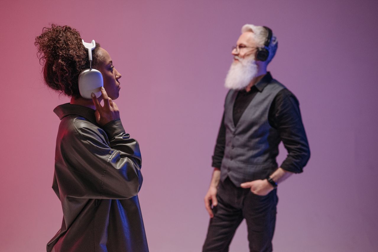 A museum visitor using a digital audio guide while exploring an exhibition